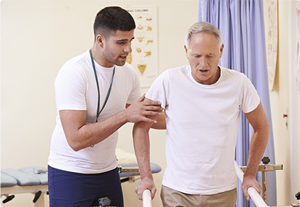 Physical therapist working with male patient 